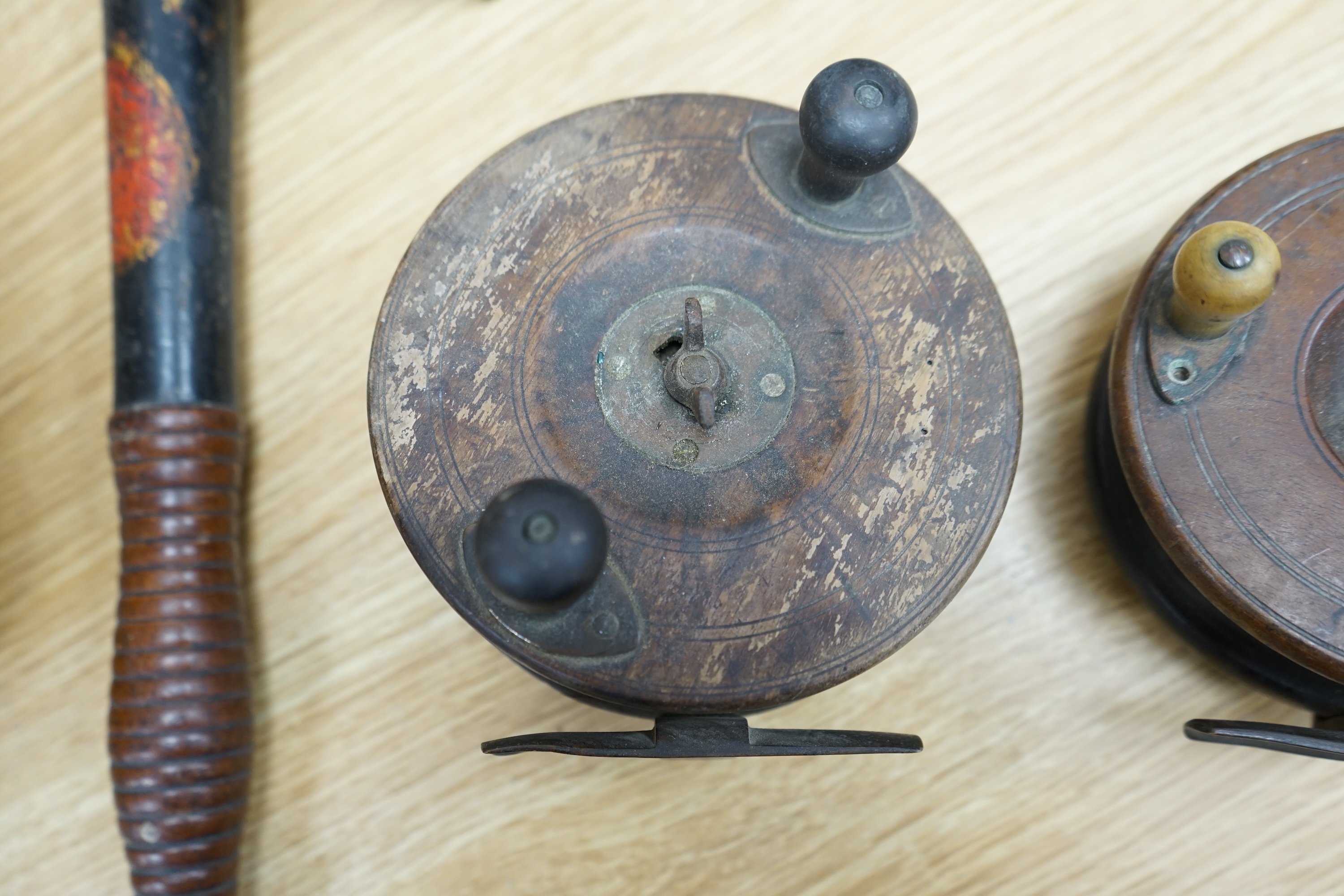 Two wooden fishing reels, a Victorian truncheon and an Arts and Crafts pewter box with enamel roundel. Truncheon 43cm long., Condition - all items worn